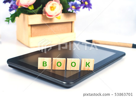 Book text on Wood block sign on mobile tablet for 53863701