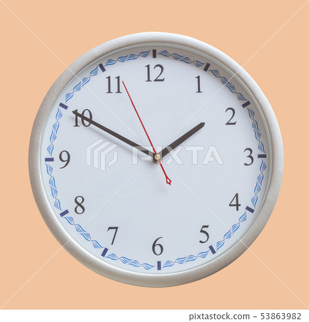 Analog wall clock on color background. Analog wall clock on color background. 53863982