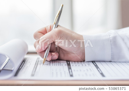 Applicant filling in company application form job Applicant filling in company application form job 53865371