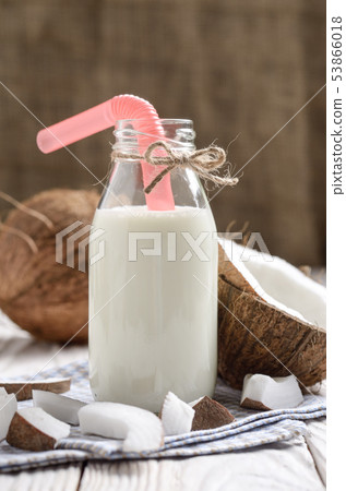 Glass bottle of milk or yogurt on blue napkin on Glass bottle of milk or yogurt on blue napkin on 53866018