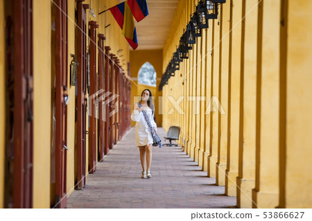 Woman walking at the walled city in Cartagena Woman walking at the walled city in Cartagena 53866627