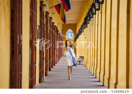Woman walking at the walled city in Cartagena Woman walking at the walled city in Cartagena 53866629
