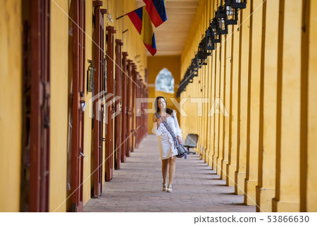 Woman walking at the walled city in Cartagena Woman walking at the walled city in Cartagena 53866630