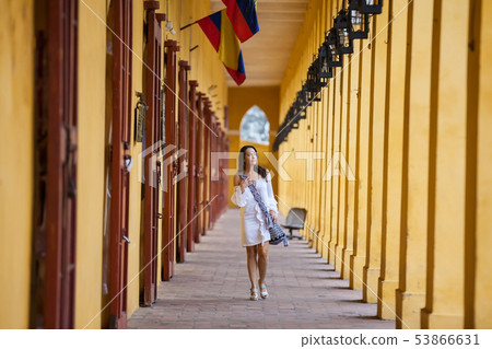 Woman walking at the walled city in Cartagena Woman walking at the walled city in Cartagena 53866631