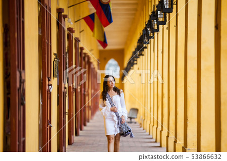 Woman walking at the walled city in Cartagena Woman walking at the walled city in Cartagena 53866632