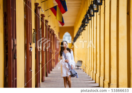 Woman walking at the walled city in Cartagena Woman walking at the walled city in Cartagena 53866633