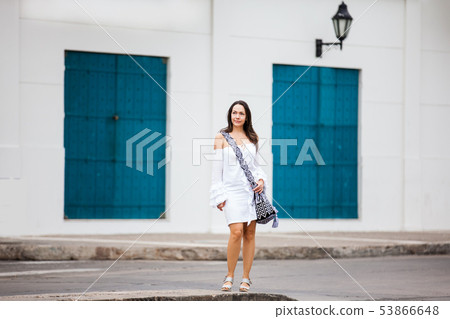 Woman walking at the walled city in Cartagena Woman walking at the walled city in Cartagena 53866648