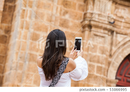 Woman taking pictures in Cartagena de Indias 53866995