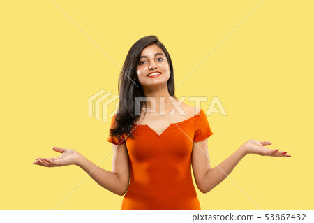 Portrait of beautiful woman isolated on yellow studio background Portrait of beautiful woman isolated on yellow studio background 53867432