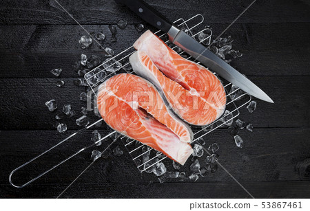 Fresh salmon steak on black background, top view 53867461