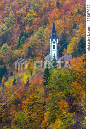 Church in Slovenia countryside, autumn trees 53867662