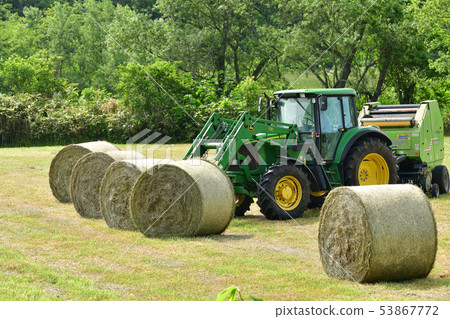 Taking a picture of the production work of a pasture roll in Yakumo, Hokkaido in early summer 53867772