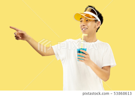 Korean young man's half-length portrait on yellow background Korean young man's half-length portrait on yellow background 53868613