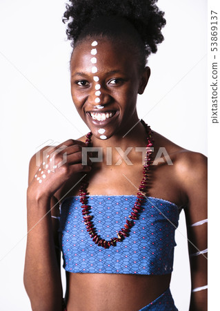 African girl with pattern on her face laughing African girl with pattern on her face laughing 53869137
