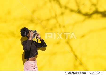 African girl photographer making picture in street 53869216