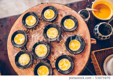Vietnamese mini fried eggs, cooking on the street - Traditional Vietnamese food 53873970