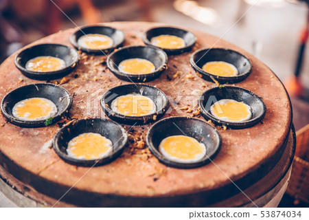 Vietnamese mini fried eggs, cooking on the street - Traditional Vietnamese food Vietnamese mini fried eggs, cooking on the street - Traditional Vietnamese food 53874034