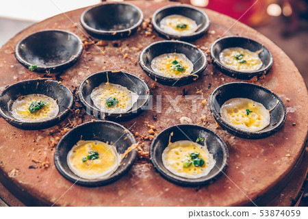 Vietnamese mini fried eggs, cooking on the street - Traditional Vietnamese food Vietnamese mini fried eggs, cooking on the street - Traditional Vietnamese food 53874059