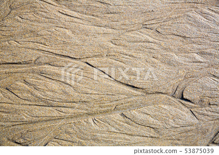 Patterns on the sand from sea water after low tide, Spain Patterns on the sand from sea water after low tide, Spain 53875039