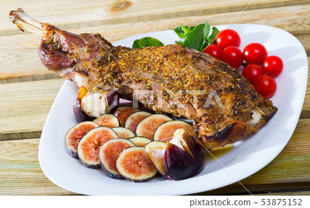 Baked shoulder of mutton with figs, tomatoes, soft cheese Baked shoulder of mutton with figs, tomatoes, soft cheese 53875152