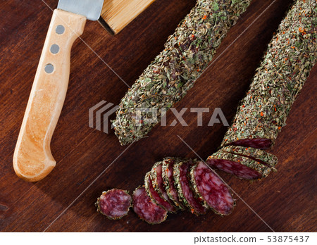 Sliced spanish sausage fuet with herbs Sliced spanish sausage fuet with herbs 53875437