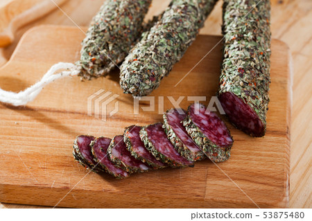 Sliced spanish sausage fuet with herbs Sliced spanish sausage fuet with herbs 53875480