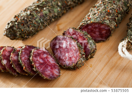 Sliced spanish sausage fuet with herbs 53875505