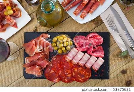 Top view of meat platter on slate board 53875621