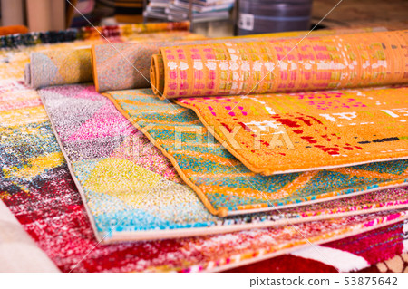Various colorful wool rugs for sale at store Various colorful wool rugs for sale at store 53875642
