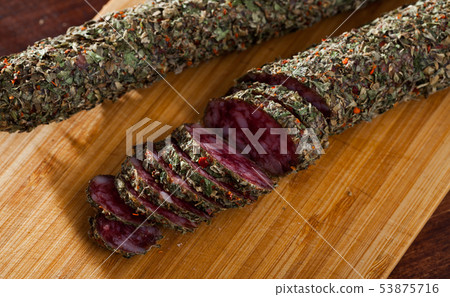 Sliced spanish sausage fuet with herbs Sliced spanish sausage fuet with herbs 53875716