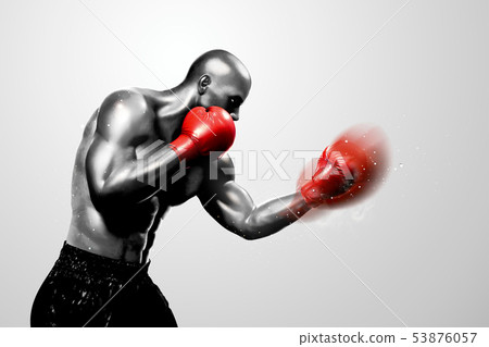 Strong boxer throwing a hook 53876057