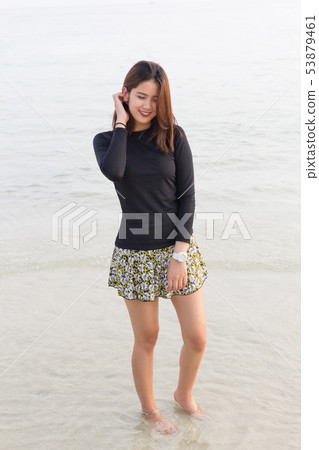 Asian beautiful woman relax on the beach Asian beautiful woman relax on the beach 53879461