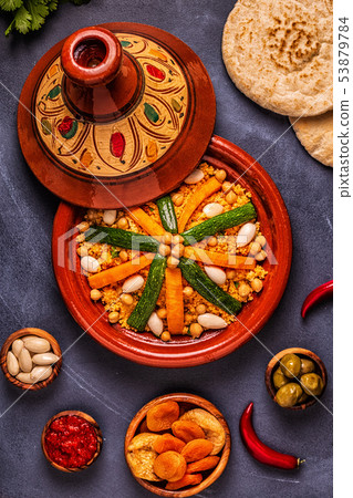 Vegetable tagine with almond and chickpea couscous Vegetable tagine with almond and chickpea couscous 53879784