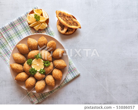 Arabic meat appetizer Kibbeh.  53886057