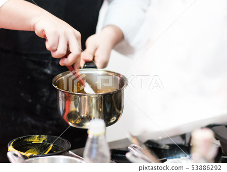 Chef cooking food in the kitchen, Chef preparing Chef cooking food in the kitchen, Chef preparing 53886292