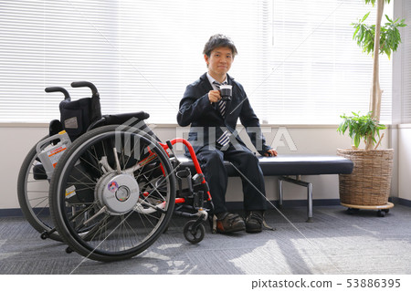 Wheelchair employee taking a break Wheelchair employee taking a break 53886395