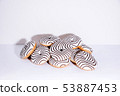 Striped donuts on a white background. 53887453