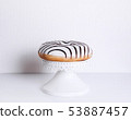 Striped donuts on a white background. 53887457