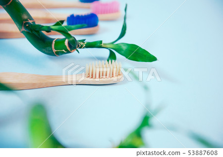 Flat lay composition with bamboo toothbrush and space for text Flat lay composition with bamboo toothbrush and space for text 53887608