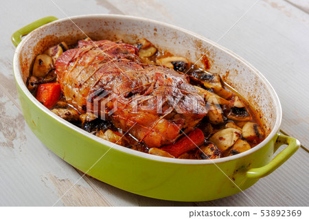 roast pork with mushrooms and tomatoes 53892369