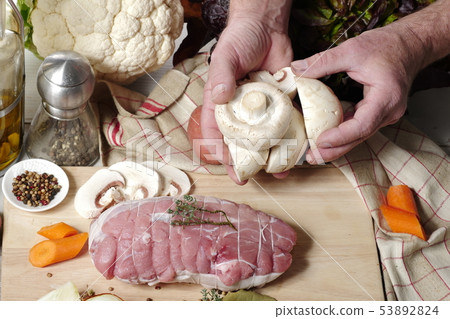 preparation of uncooked roast pork with mushrooms preparation of uncooked roast pork with mushrooms 53892824