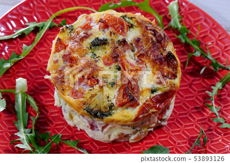 quiche lorraine in red plate 53893126