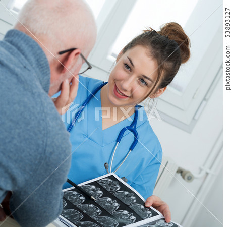 young female doctor in the office with her patient young female doctor in the office with her patient 53893127