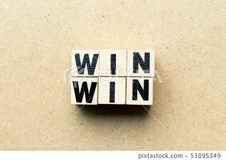Letter block in word win win on wood background Letter block in word win win on wood background 53895349