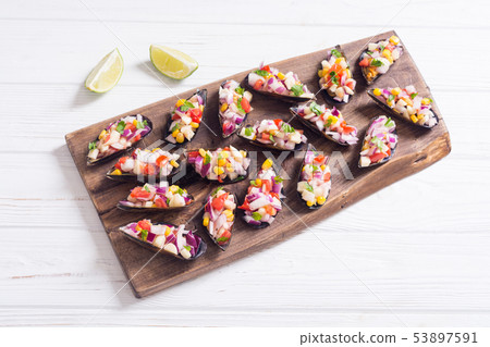 Traditional Peruvian food background with mussels Traditional Peruvian food background with mussels 53897591