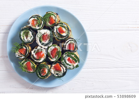 Zucchini rolls with cream cheese , tomatoes and Zucchini rolls with cream cheese , tomatoes and 53898609