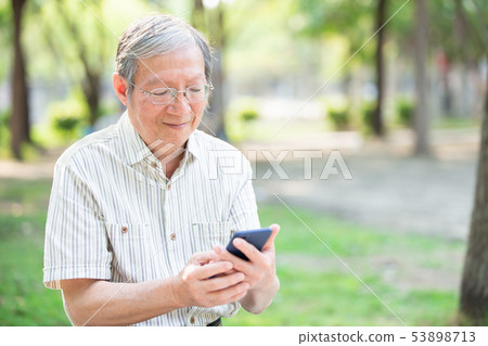 Older man use cellphone Older man use cellphone 53898713