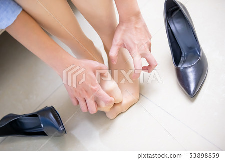 Businesswoman with athlete foot Businesswoman with athlete foot 53898859
