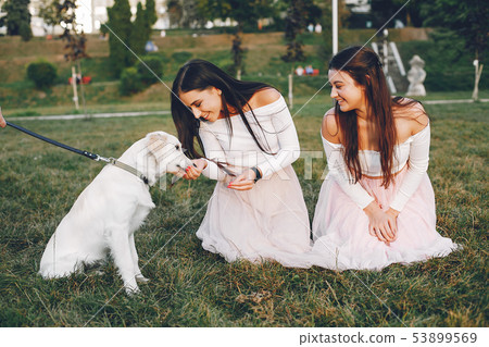 Two pretty girls in a summer park Two pretty girls in a summer park 53899569