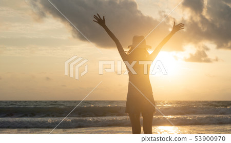 Happy Asian woman relaxing and enjoying at the 53900970